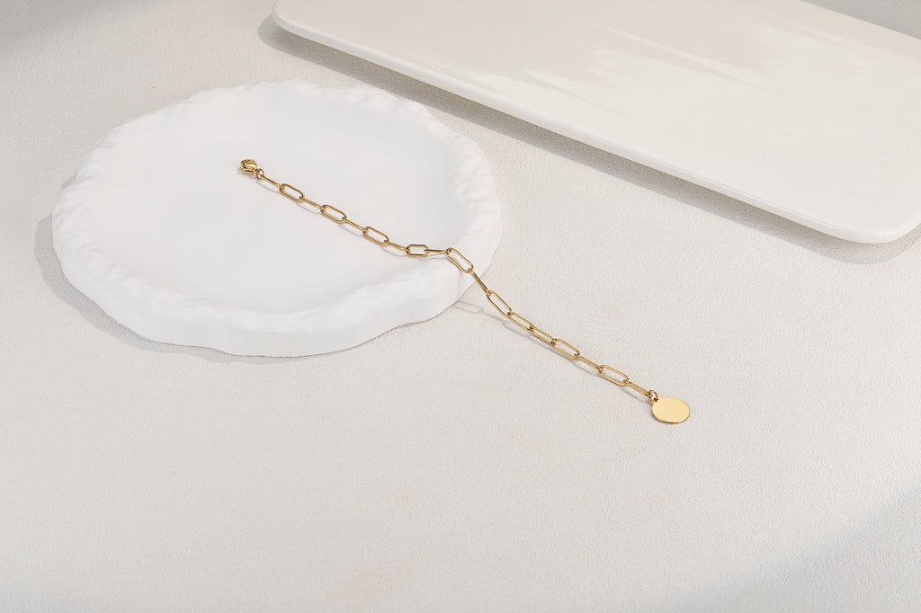 Stainless steel armbandje met ronde bedel goldplated